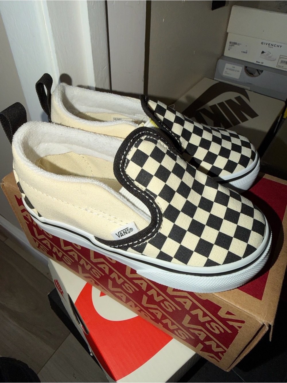 Vans Kids Slip-On Sneakers in Black & Cream Checkerboard